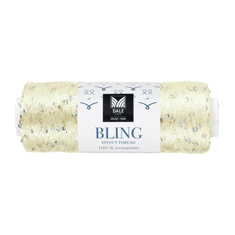 Et lyst nøgle effektgarn med banderole og synlige glitrende detaljer.